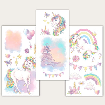 Three sheets of small rub-on transfers featuring pastel unicorns, rainbows, butterflies, roses, balloons, clouds, and a castle on a mountain are against a light beige background.