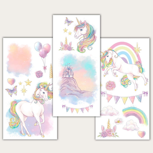 Three sheets of small rub-on transfers featuring pastel unicorns, rainbows, butterflies, roses, balloons, clouds, and a castle on a mountain are against a light beige background.