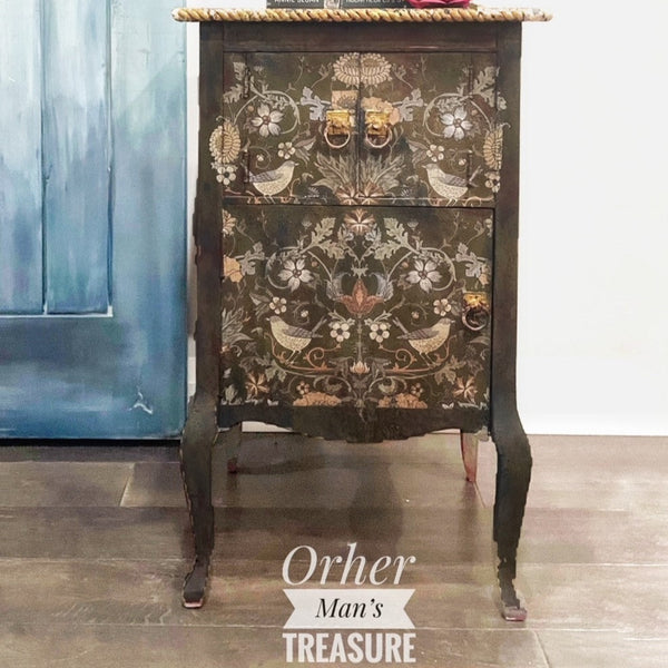 A vintage side table refurbished by Other Man's Treasure is painted distressed brown and features ReDesign with Prima's Albery transfer on its 3 doors.