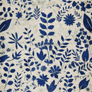 Close-up of a rice paper design that features a creamy canvas with faint print that serves as the perfect background for the striking blue floral and leaves pattern.