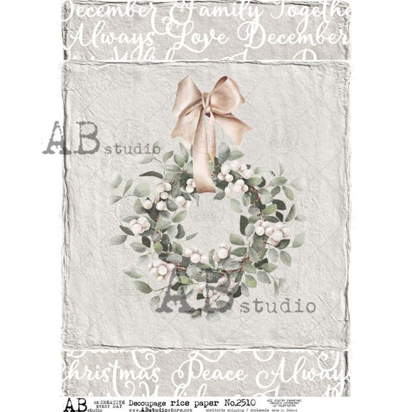 A4 rice paper design that features a country wreath against a distressed gray backdrop with Christmas words bordering the top and bottom is against a white background.