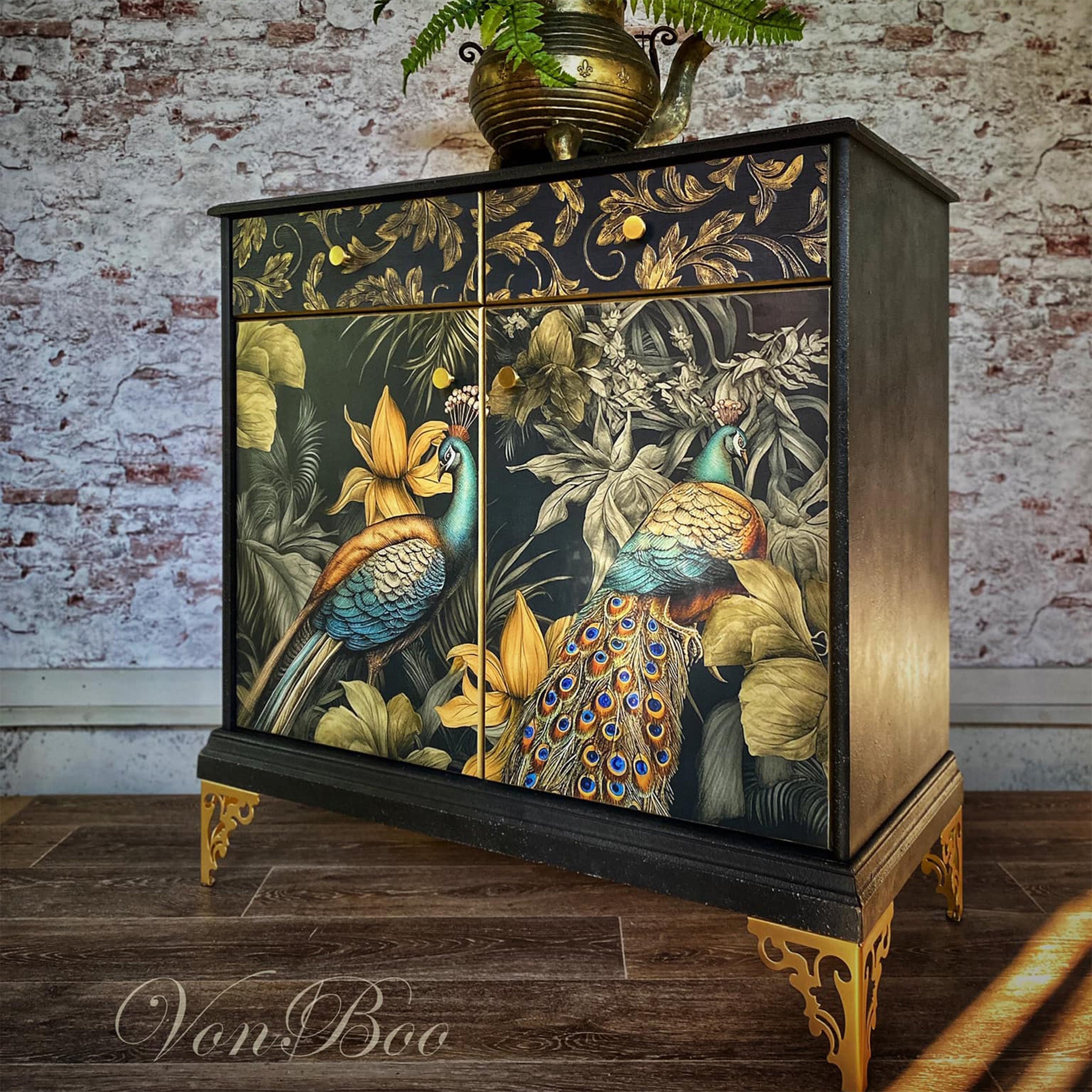 A vintage small buffet cabinet refurbished by Von Boo is painted black with gold accents and features Mint by Michelle's A Peacock Pair decoupage paper on the front 2 doors.