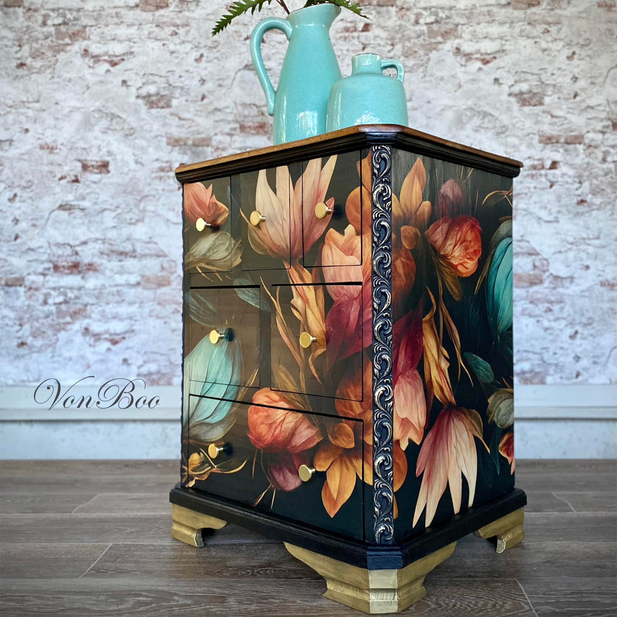 A vintage nightstand with 6 drawers refurbished by Von Boo is painted black and features Mint by Michelle's Autumn decoupage paper on it.