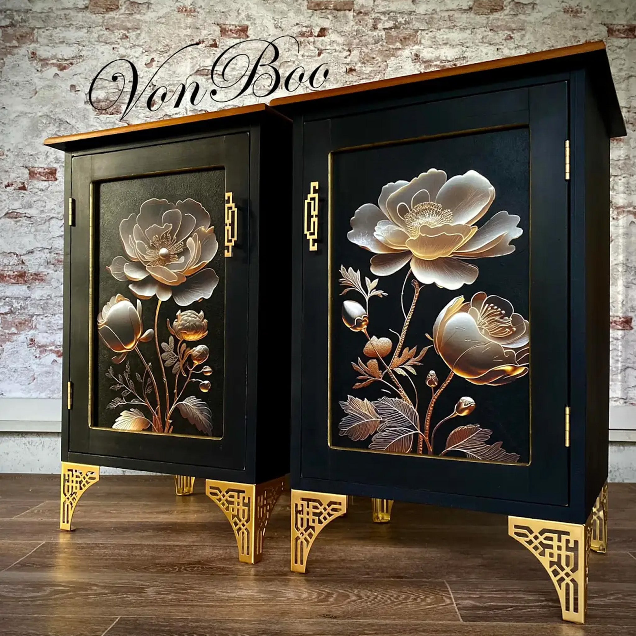 Two nightstands with large single doors refurbished by Von Boo are painted black with gold legs and feature Mint by Michelle's Golden Bloom 1 decoupage paper on the right nightstand door inlay.