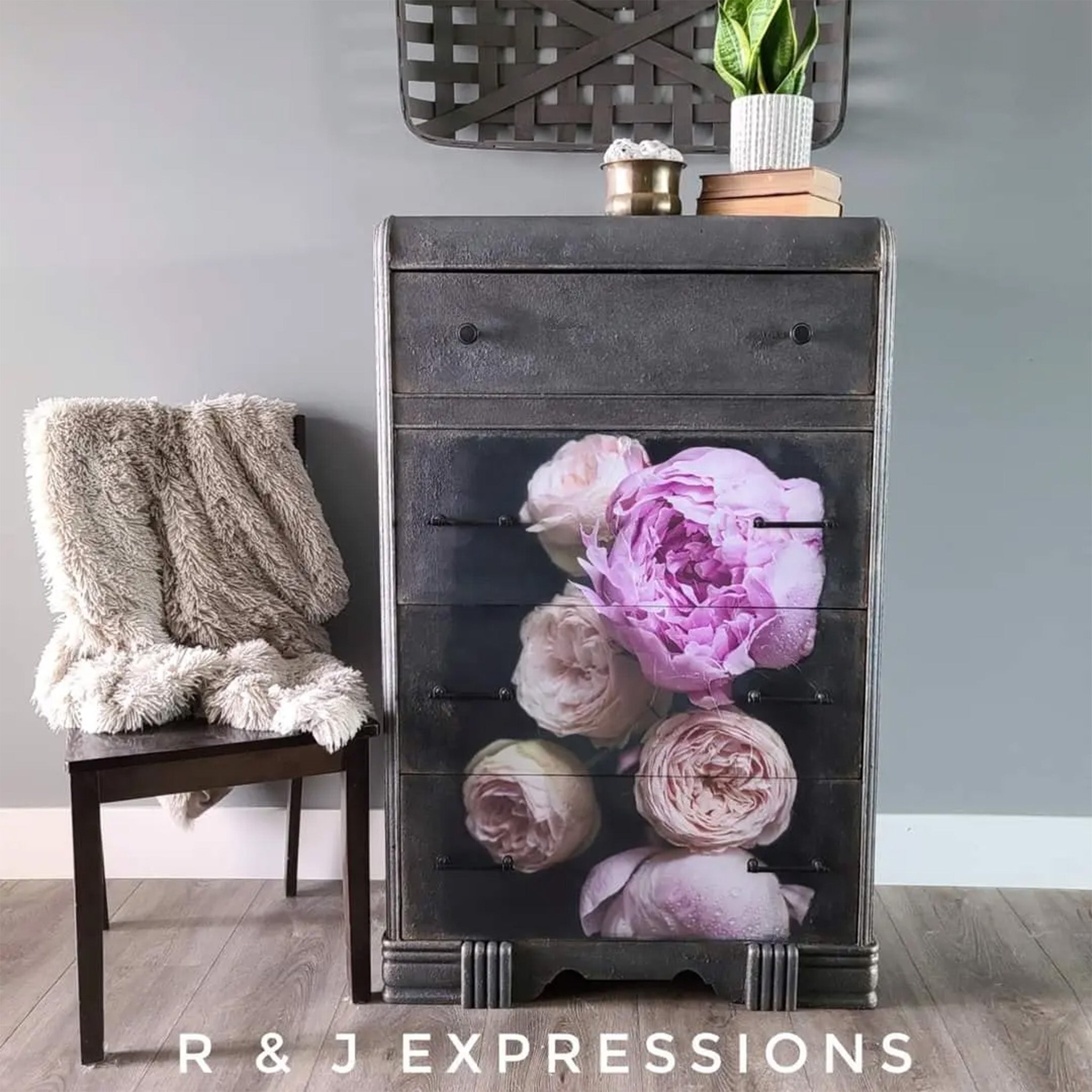 A 4-drawer chest dresser refurbished by R & J Expressions is painted dark grey and features Mint by Michelle's Moody Florals 2 decoupage paper on the bottom 3 drawers.