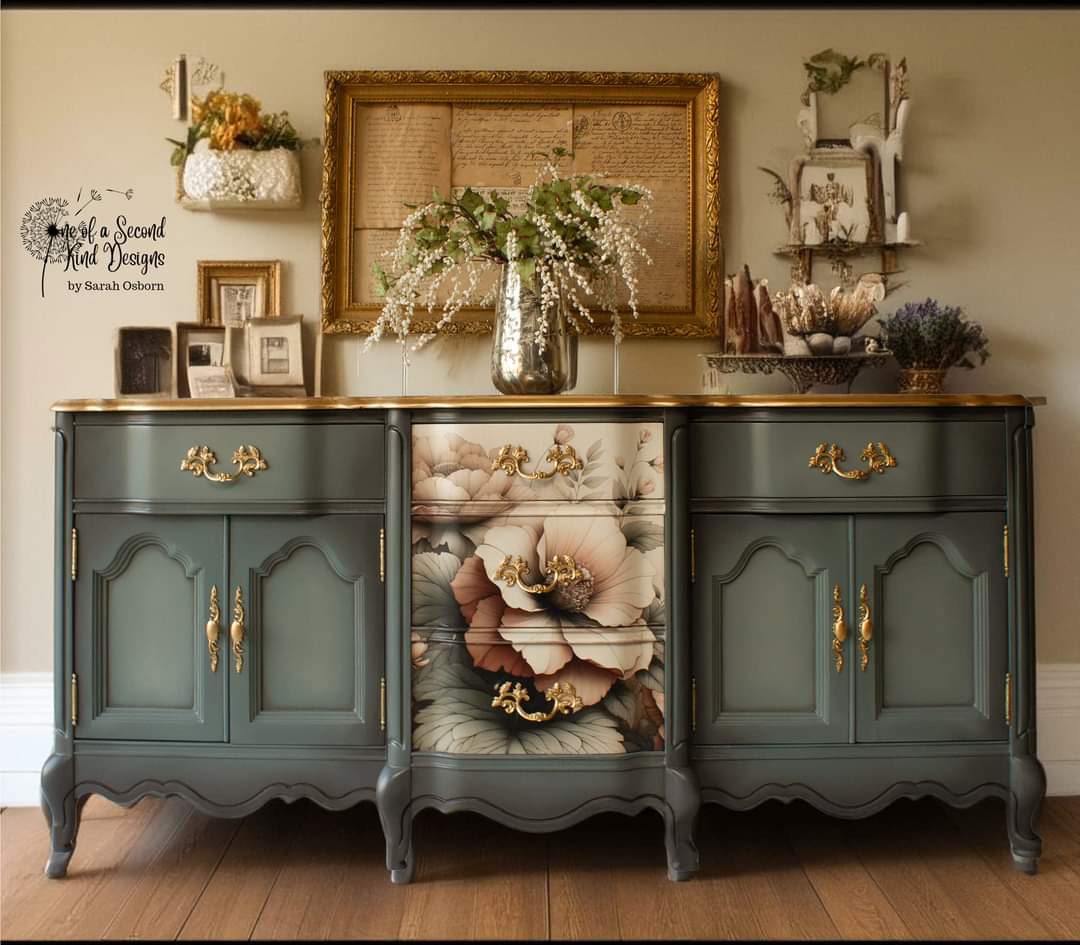 A vintage large buffet cabinet refurbished by One of a Second Kind Designs is painted grey and features Mint by Michelle's Peach Petals decoupage paper on its 3 center drawers.