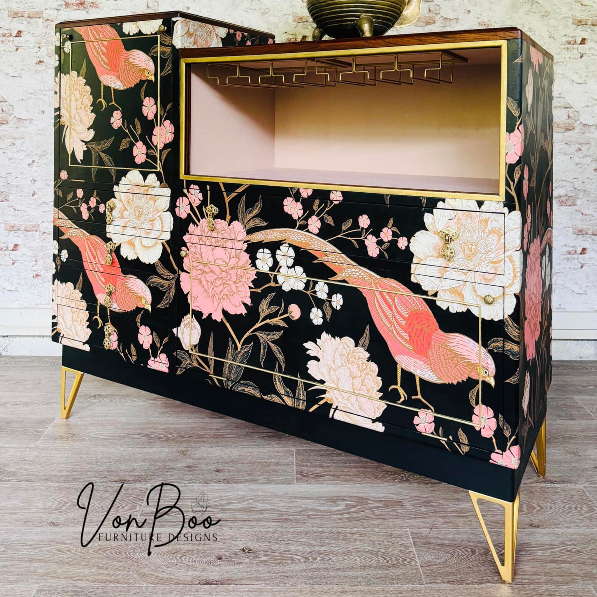 A vintage dresser refurbished by Von Boo is painted black and features Mint by Michelle's Pheasant decoupage paper on it.