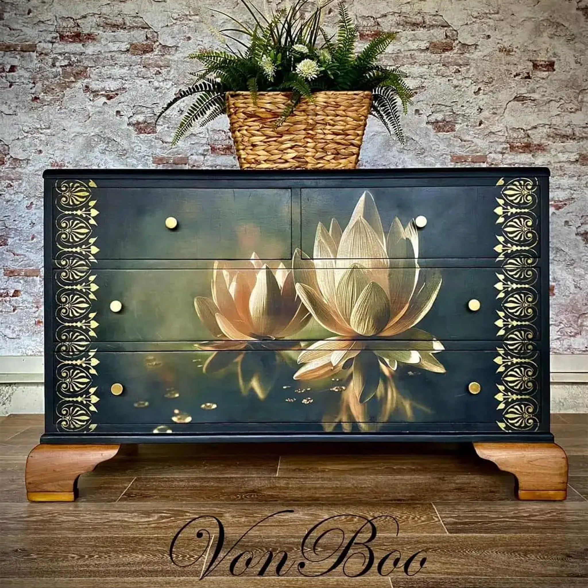 A 4-drawer dresser refurbished by Von Boo is painted blue-black and features Mint by Michelle's Water Lily decoupage paper on it.