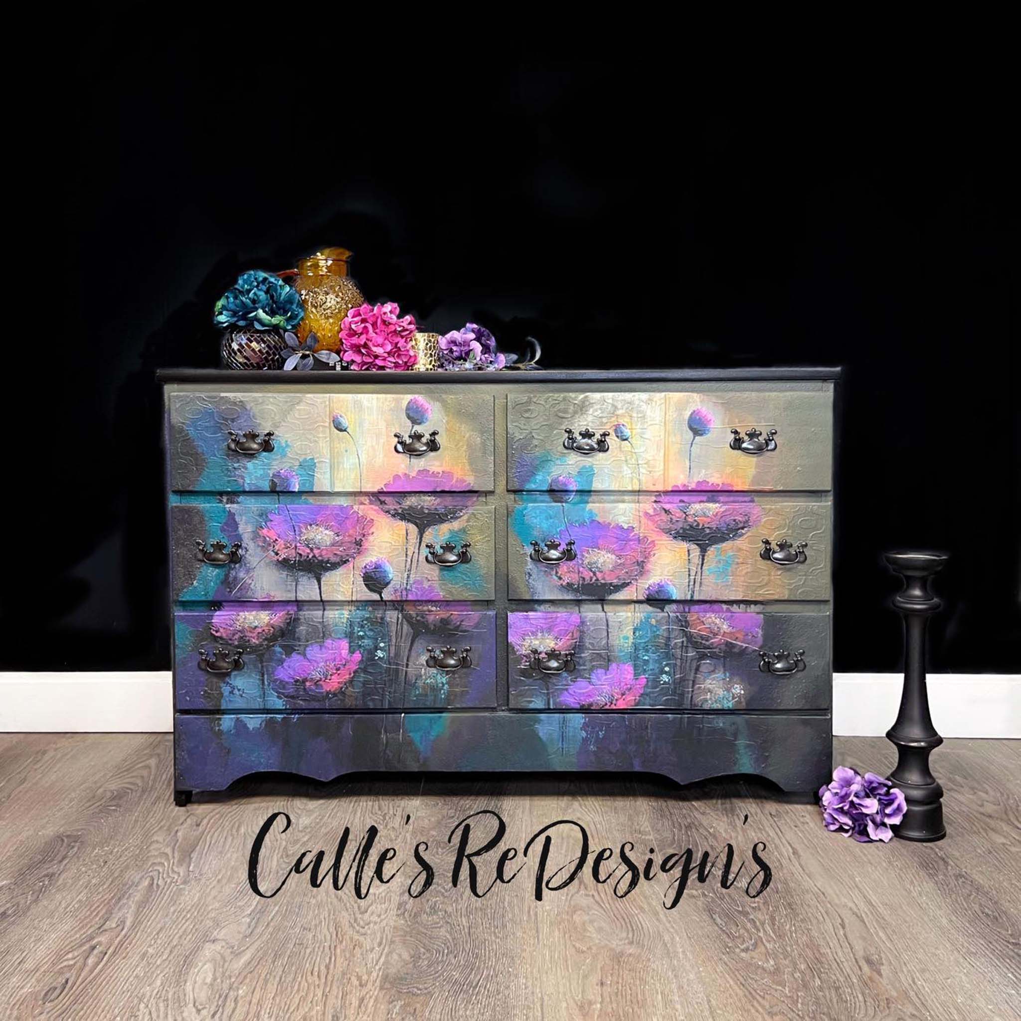 A 6-drawer dresser refurbished by Calle's ReDesign's is painted dark grey and features Whimsykek's Purple Poppies tissue paper on its drawers.