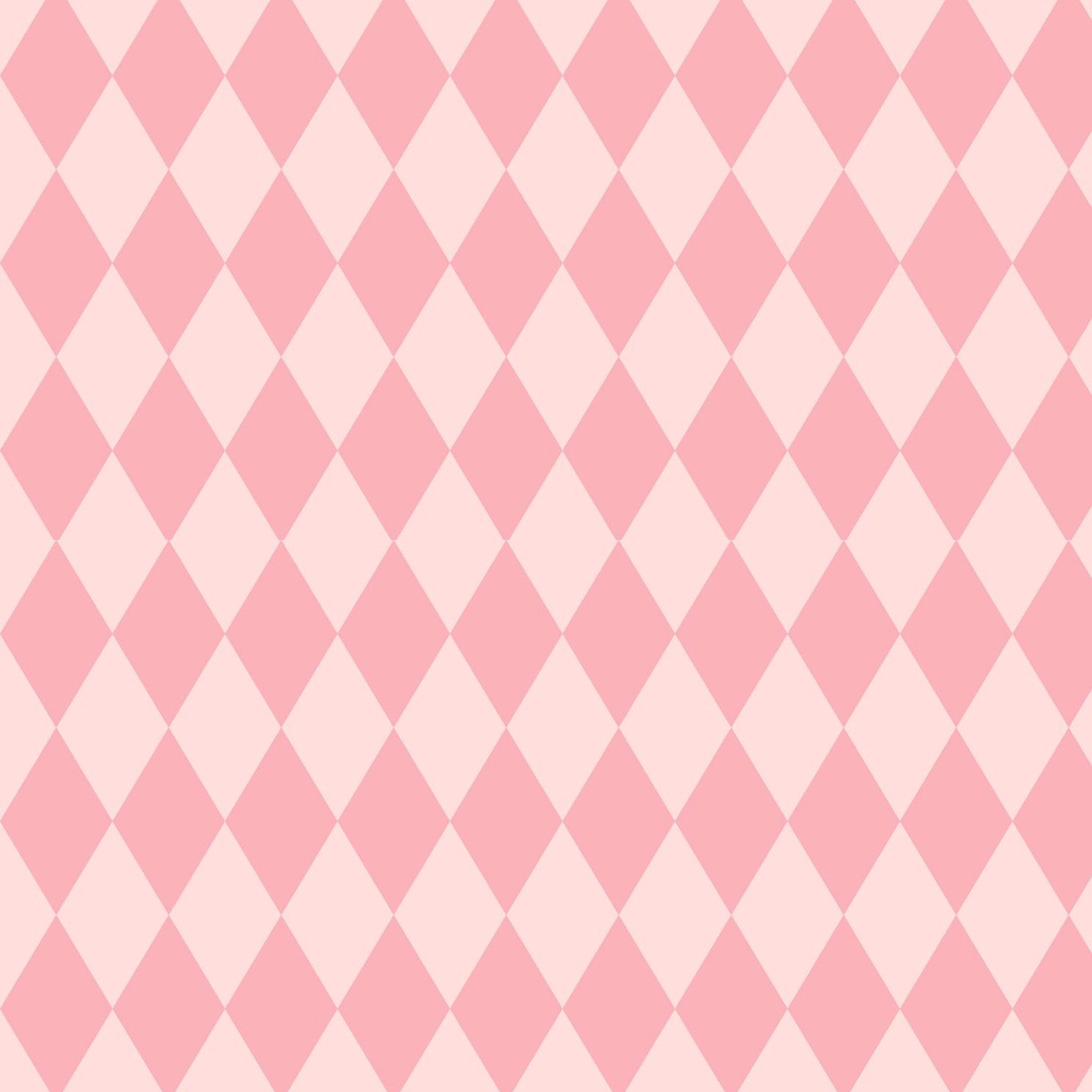 Close-up of a tissue paper design featuring a playful pink harlequin diamond pattern.