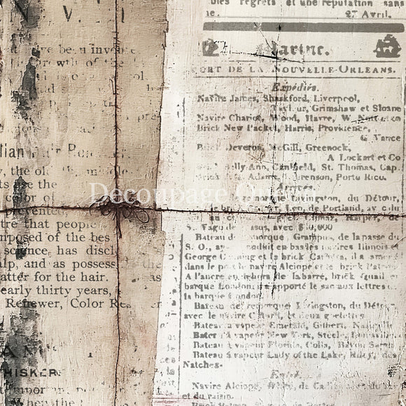 Close-up of an old newspaper with visible wear and tear, featuring text and a visible brand name.
