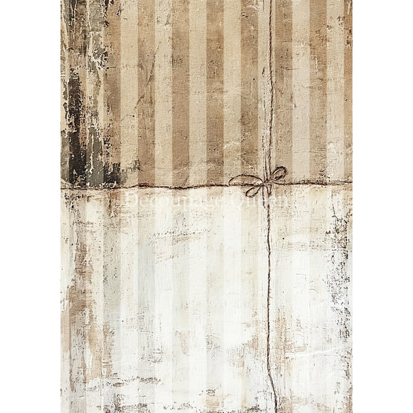 Textured beige and brown patterned paper with a string on a white background