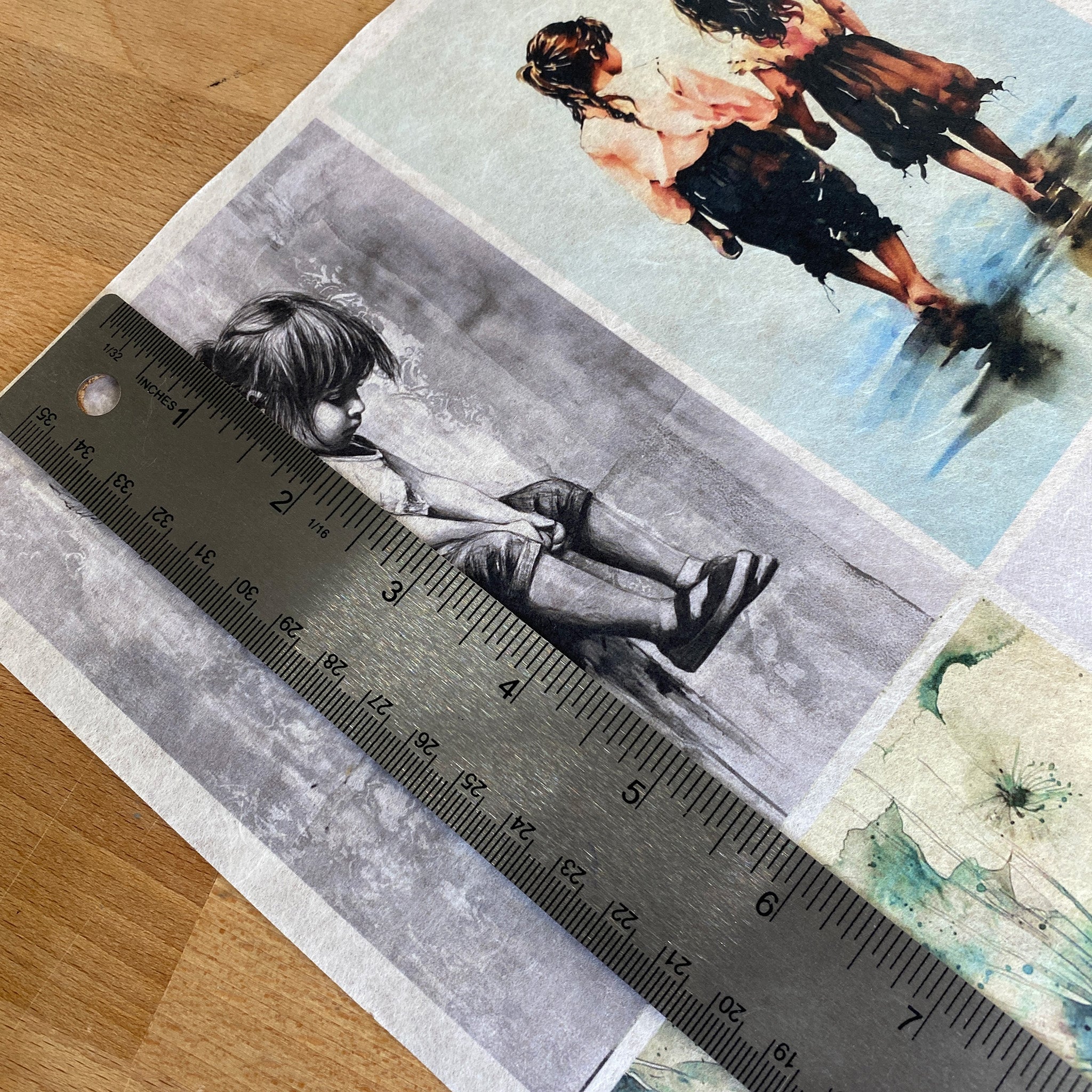 A close-up of Decoupage Queen's Four Peaceful Scenes A4 rice paper shows a silver ruler over one of the designs showing a measurement of 5.75 inches high.