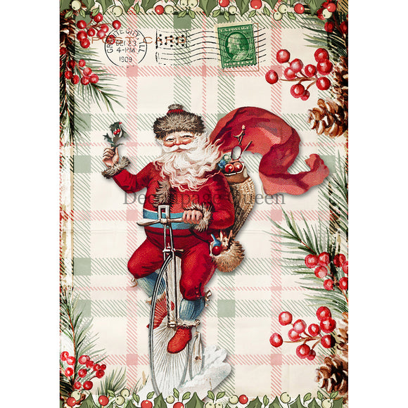 Rice paper featuring a postcard of Santa riding a Penny-farthing bicycle while delivering gifts against a cozy plaid background framed by Christmas holly.