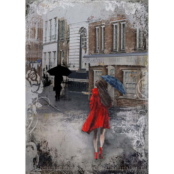 Rice paper design that features a charming woman in a red coat walking down a wet street. White borders are on the sides.