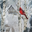 Close-up of a rice paper featuring a charming scene of a cardinal nestled in a birch tree against a snowy backdrop.