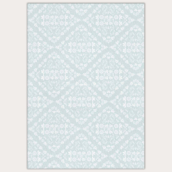 A4 rice paper that features quilted diamonds of dainty white flowers sit against a light blue background. Light beige borders are on the sides.