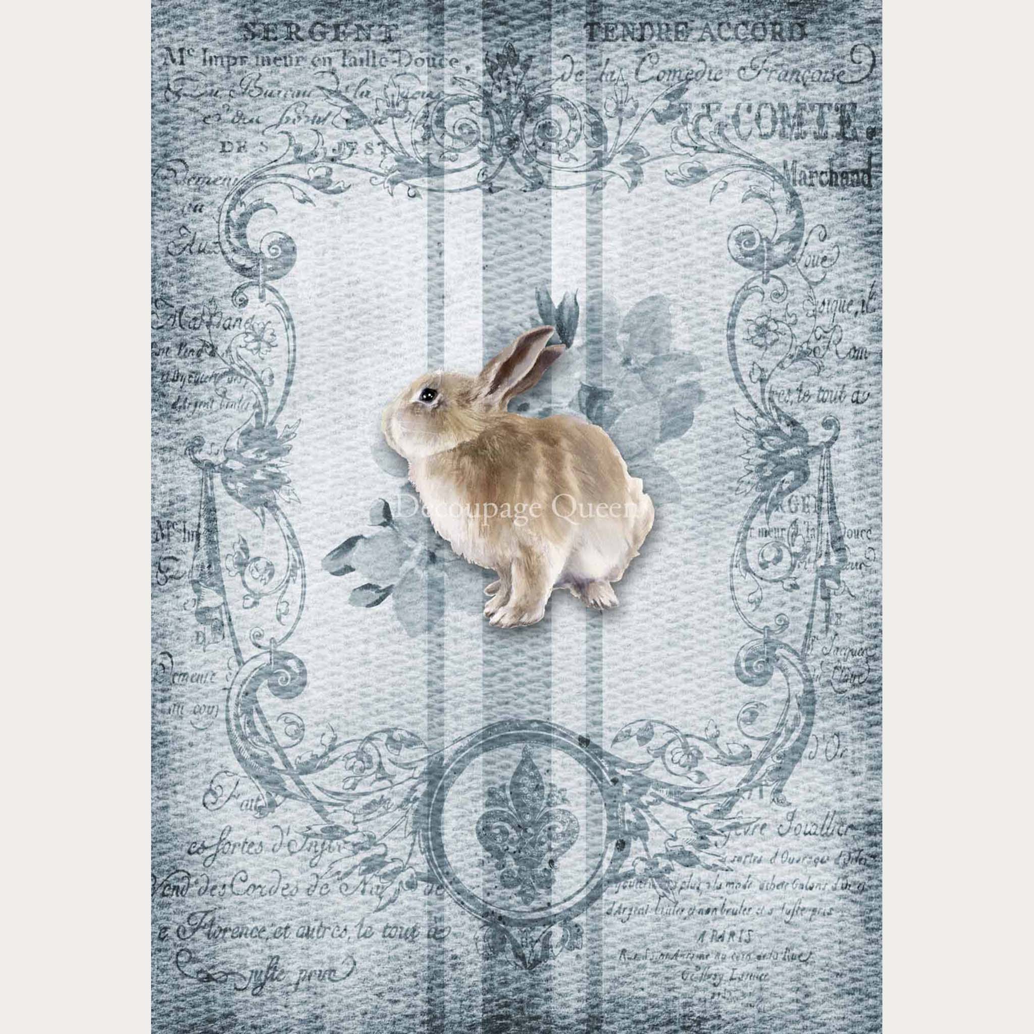 A2 rice paper designs of faded French writing with a bunny on a blue grain sack pattern. White borders are on the sides.