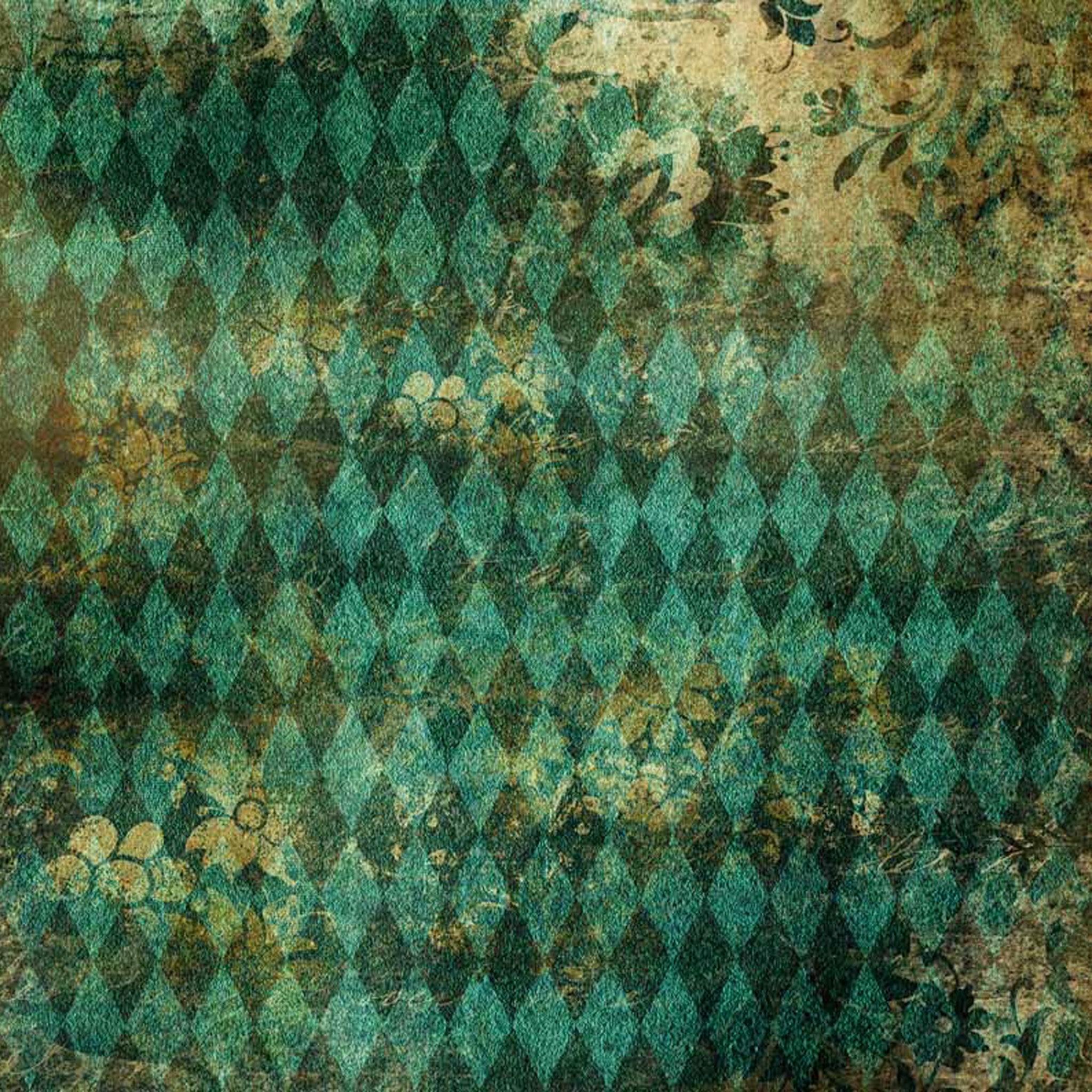 Close-up of a rice paper featuring a vintage print of teal harlequin and a distressed sepia overlay.