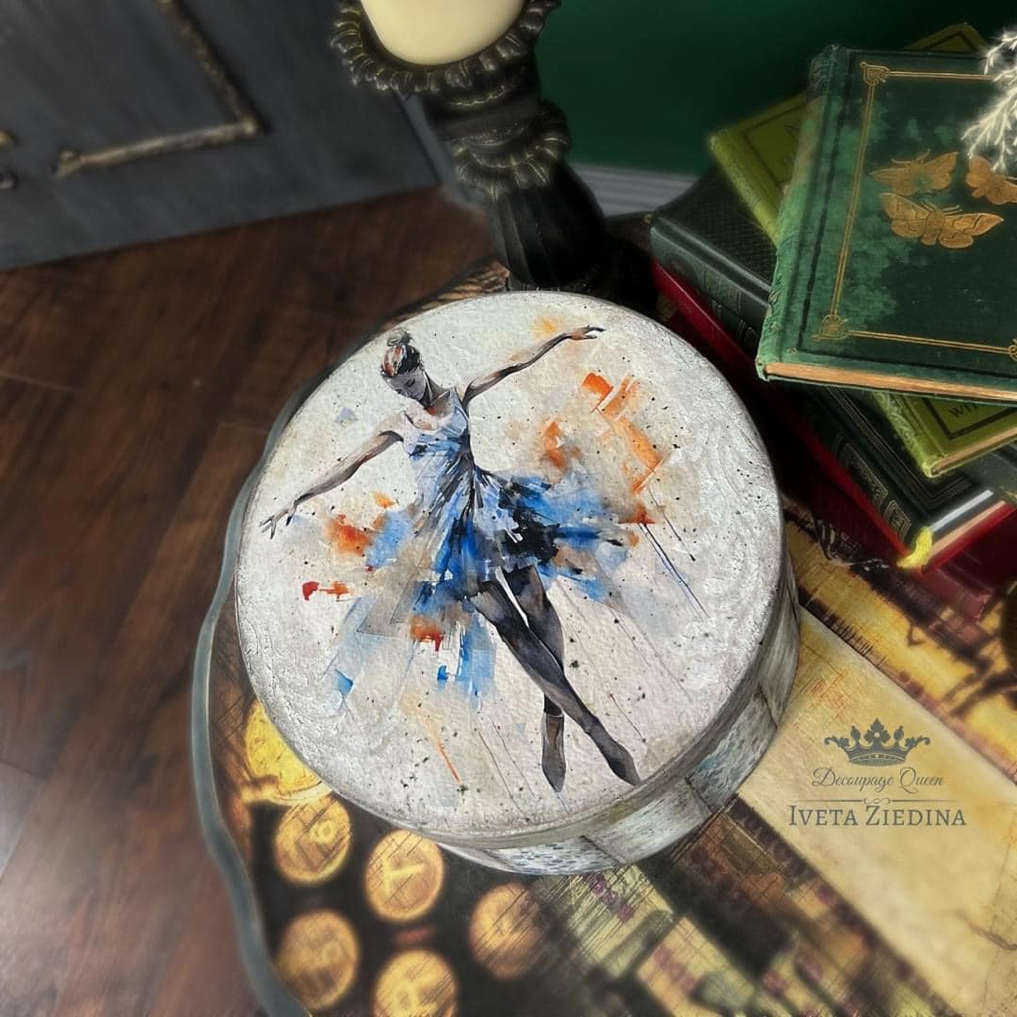 A round hat box created by Iveta Ziedina features Decoupage Queen's Virtuoso by Andy Skinner rice paper on the lid.