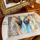 A decor tray refurbished by Salvage Made Chic features Decoupage Queen's Watercolor Wings 1 rice paper on it.