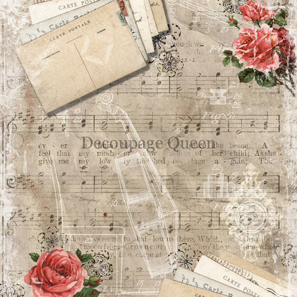 Close-up of a rice paper featuring vintage sheet music, delicate pink floral accents and charming notecards. 