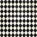 Close-up of a rice paper that features a classic black and white harlequin diamond pattern.