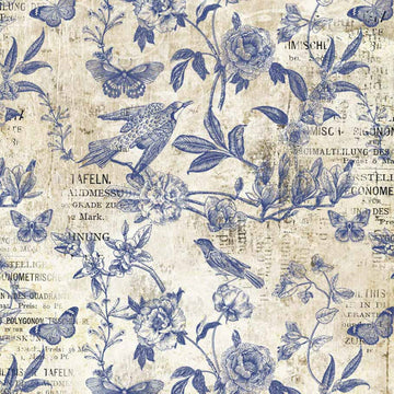 Close-up of a rice paper design that features blue stamped birds, butterflies, and vining flowers on vintage magazine paper.