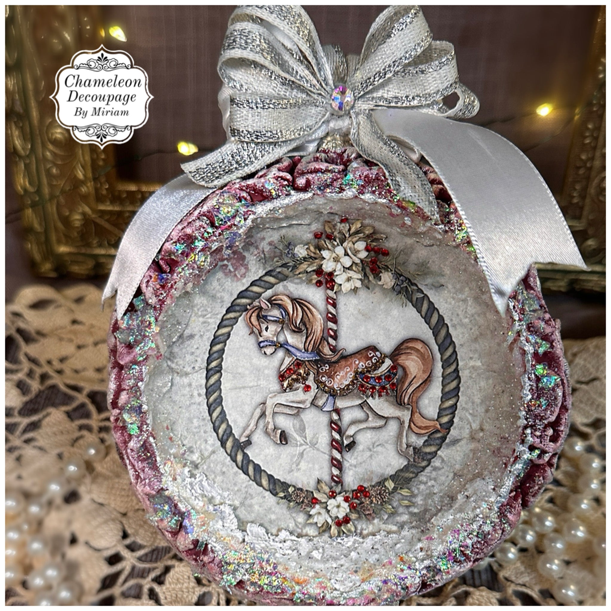 A round frame craft created by Chameleon Decoupage by Miriam features a Decoupage Queen's Carousel 1 rice paper on it.