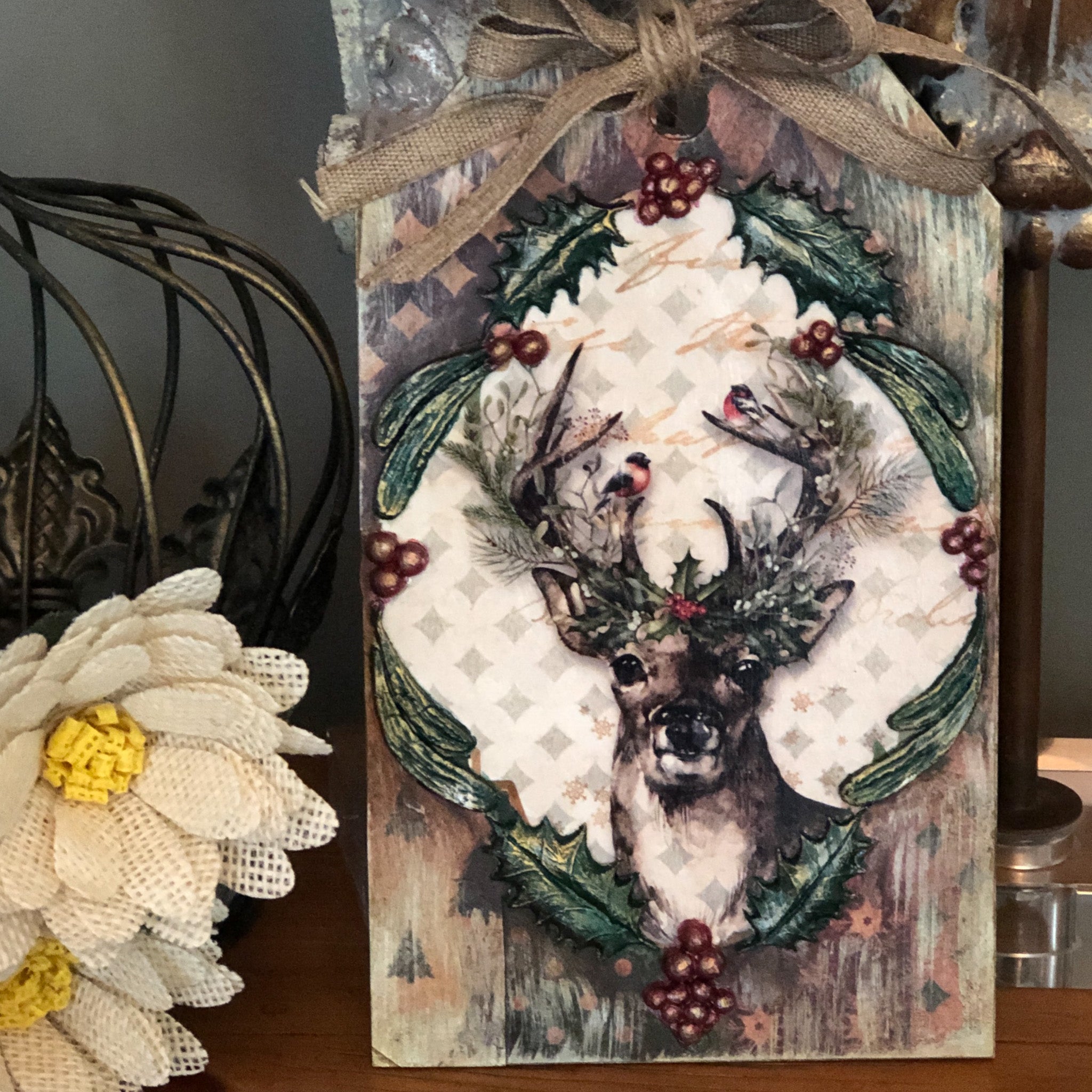 A wood craft features Decoupage Queen's Christmas Reindeer rice paper on it.