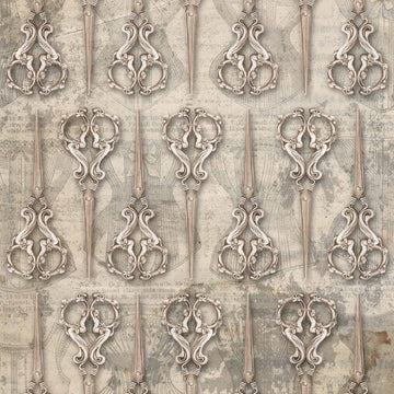 Close-up of a rice paper featuring a repeating design of antique sewing scissors over a faint backdrop of other atelier images.