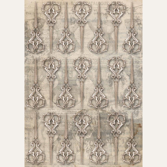 Rice paper featuring a repeating design of antique sewing scissors over a faint backdrop of other atelier images. White borders are on the sides.