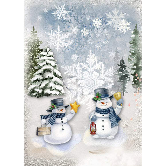 Rice paper featuring a snowy winter design with 2 snowmen in front of snow-covered Christmas trees and large snowflakes.