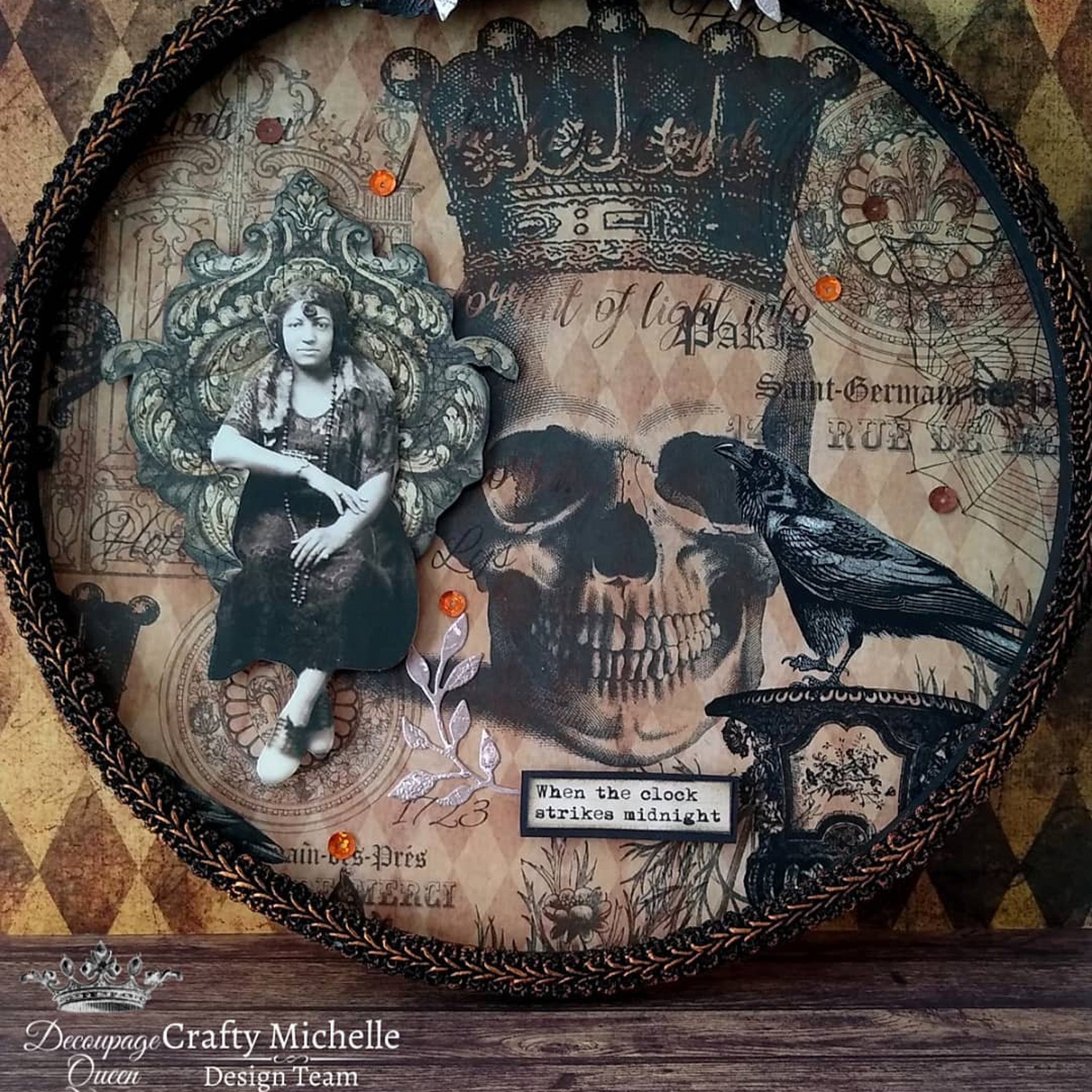 A round tray features Decoupage Queen's Halloween Raven with Skull and Gate rice paper on it.