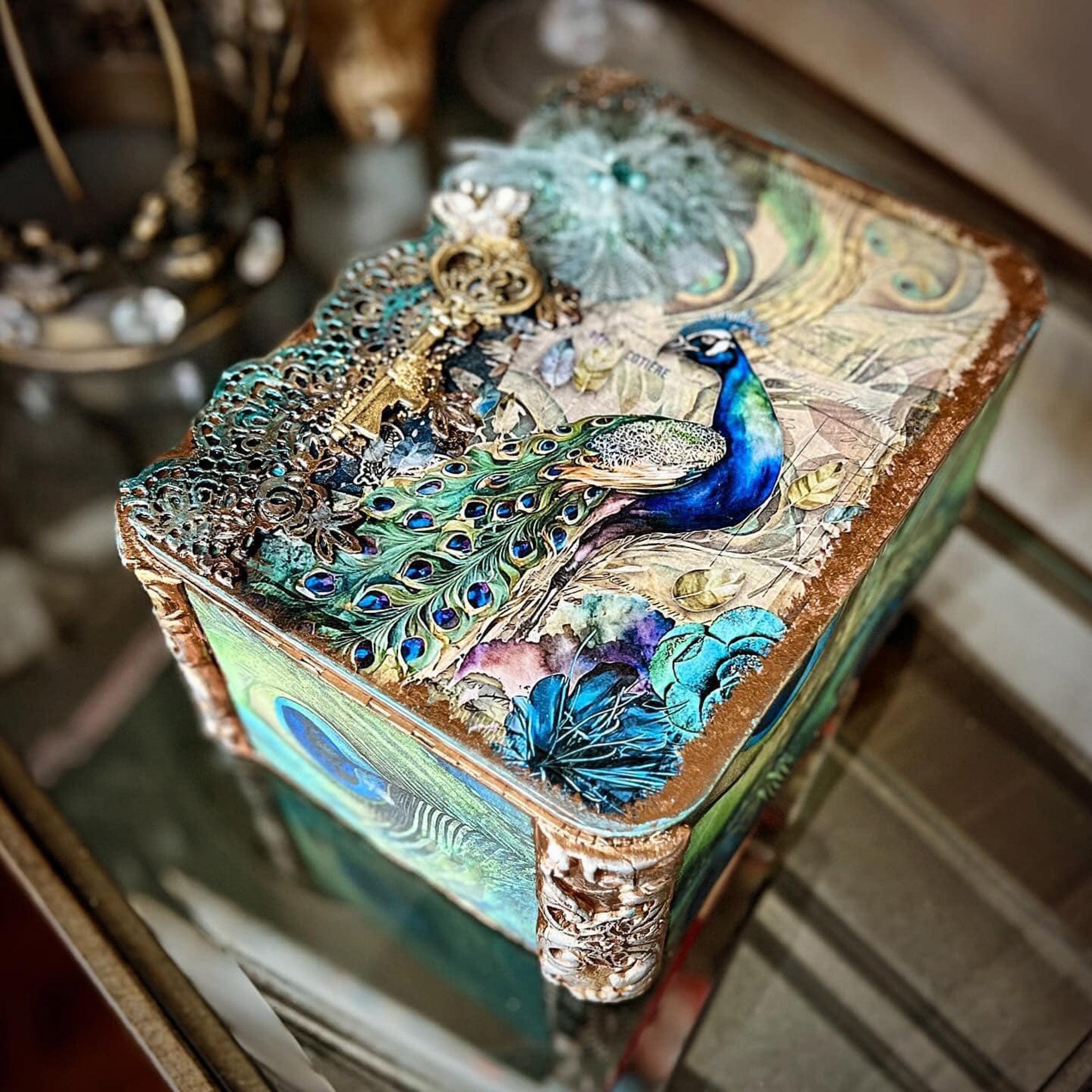 A small jewelry box features Decoupage Queen's Jeweled Peacock rice paper on the lid.