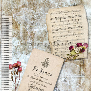 Close-up of a rice paper featuring vintage sheet music, pink roses, and a piano keys against a distressed background.