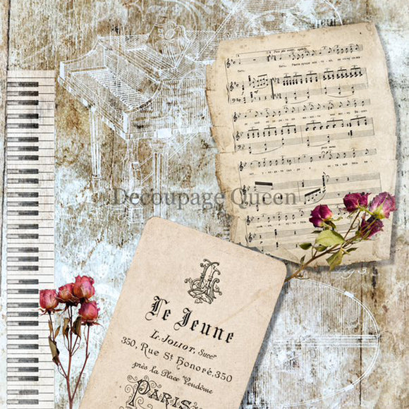 Close-up of a rice paper featuring vintage sheet music, pink roses, and a piano keys against a distressed background.