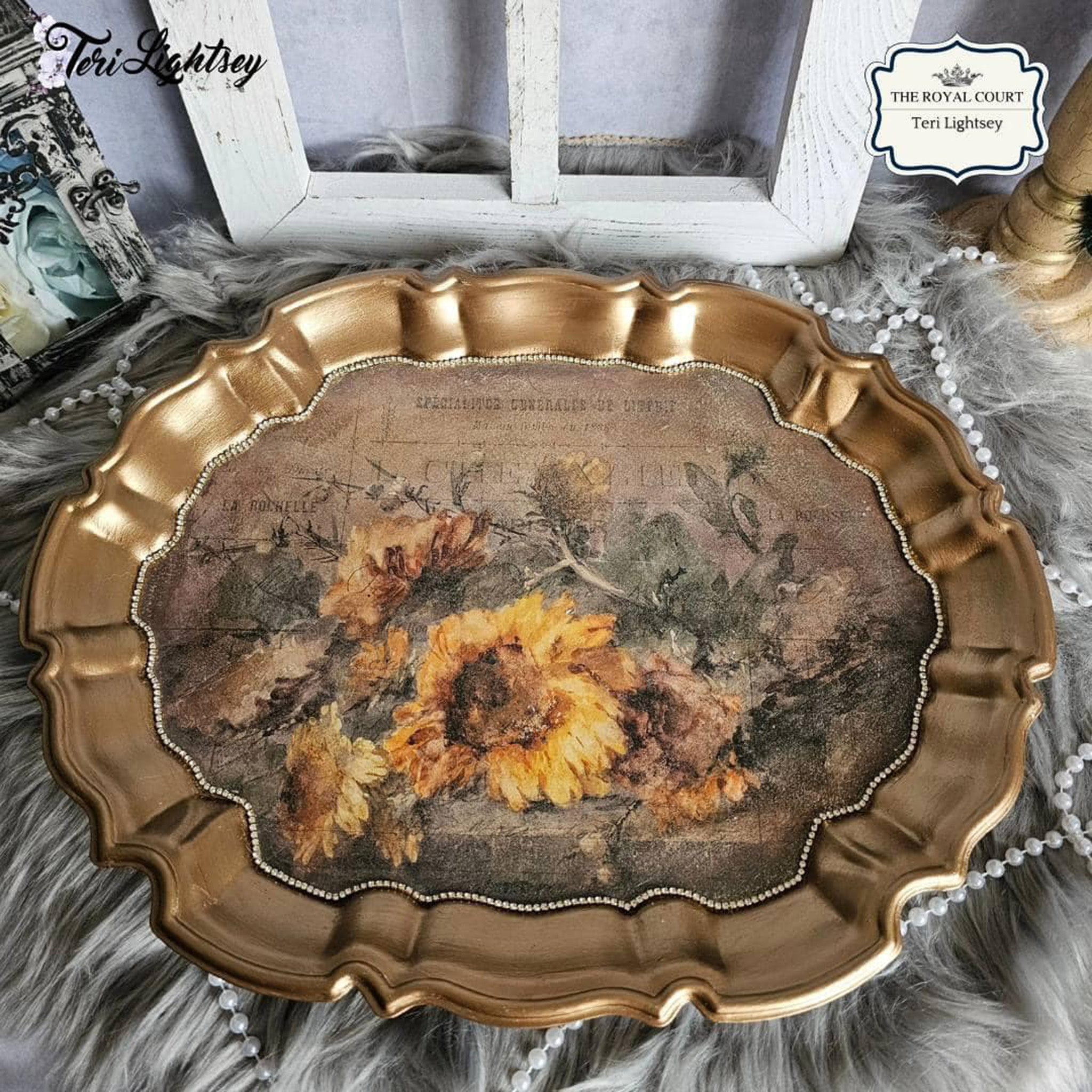 A vintage serving tray is painted gold and features Decoupage Queen's Rochelle rice paper on it.