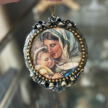 A small ornate round pendant features Decoupage Queen's The Gift A4 rice paper on it.