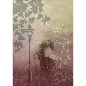 Rice paper featuring the silhouette of a woman with an umbrella by a street lamp surrounded by leaves. White borders are on the sides.