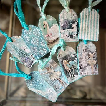 Ten gift tags with blue ribbons feature Decoupage Queen's Winter Minis A4 rice paper on them.