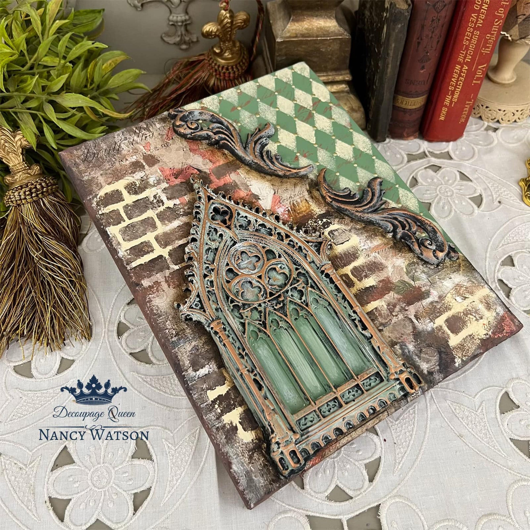 A canvas created by Nancy Watson features a painted casting created from Decoupage Queen's Gothic Window.