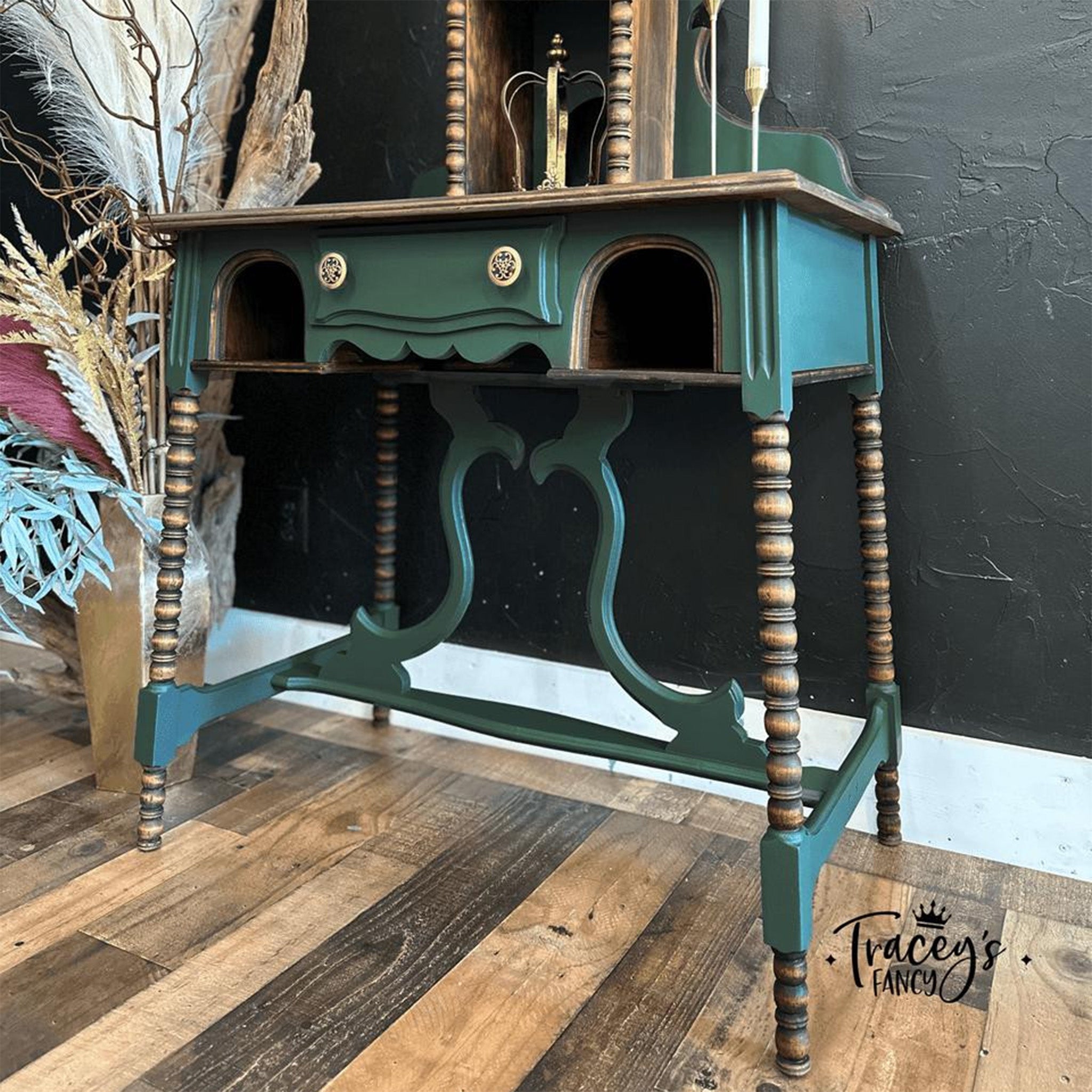 A vintage small vanity desk refurbished by Tracey's Fancy is painted in Dixie Belle's Acadia Silk Paint and has natural wood accents.