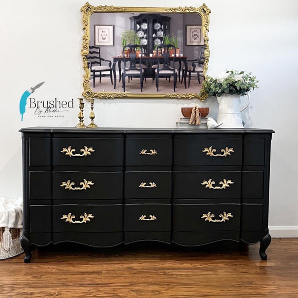 A vintage 9-drawer dresser refurbished by Brushed by Maddie features Dixie Belle's Anchor Silk All-In-One Mineral Paint.