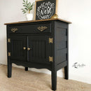 A small vintage buffet cabinet refurbished by Lilly Moon Vintage features Dixie Belle's Anchor Silk All-In-One Mineral Paint.