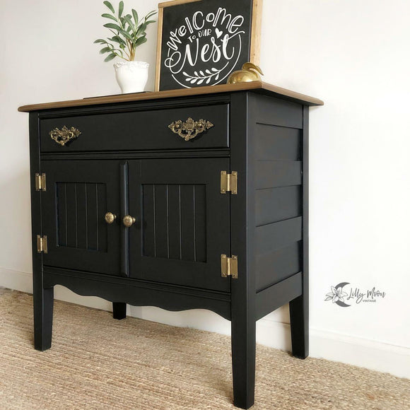 A small vintage buffet cabinet refurbished by Lilly Moon Vintage features Dixie Belle's Anchor Silk All-In-One Mineral Paint.