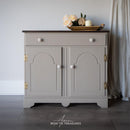 A small buffet table refurbished by Aaron Bow Tie Treasures features Dixie Belle's Badlands Silk All-In-One Mineral Paint.