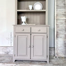A small hutch cabinet refurbished by Leah Kendricks Design features Dixie Belle's Badlands Silk All-In-One Mineral Paint.