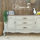 A large vintage dresser refurbished by Monnow Lane Furniture features Dixie Belle's Baja Gray Silk All-In-One Mineral Paint.