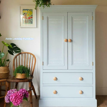 A clothing armoire refurbished by Annie Loveday Furniture features Dixie Belle's Bay Breeze Silk All-In-One Mineral Paint. 